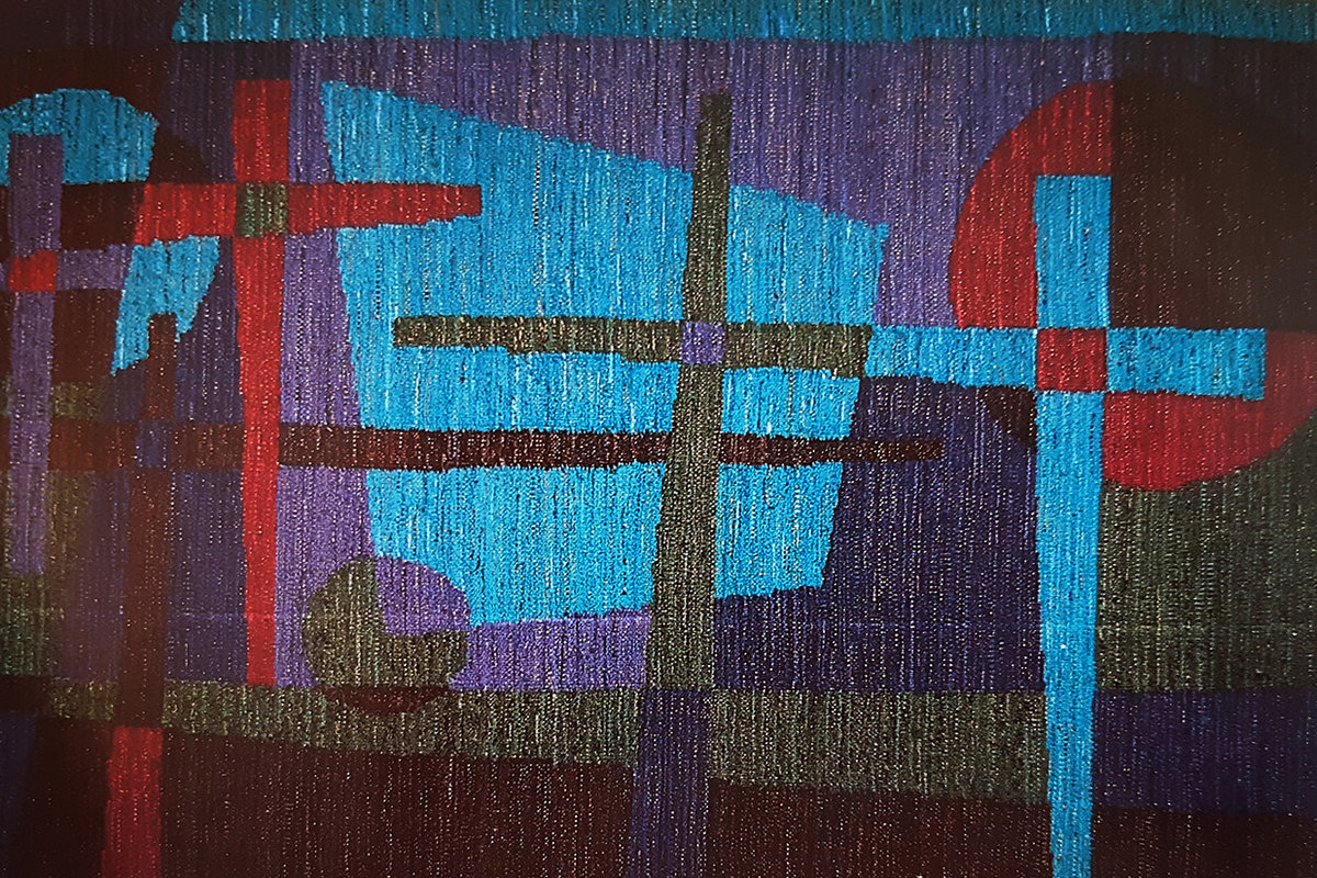 Textilarbete med olika färgs kors